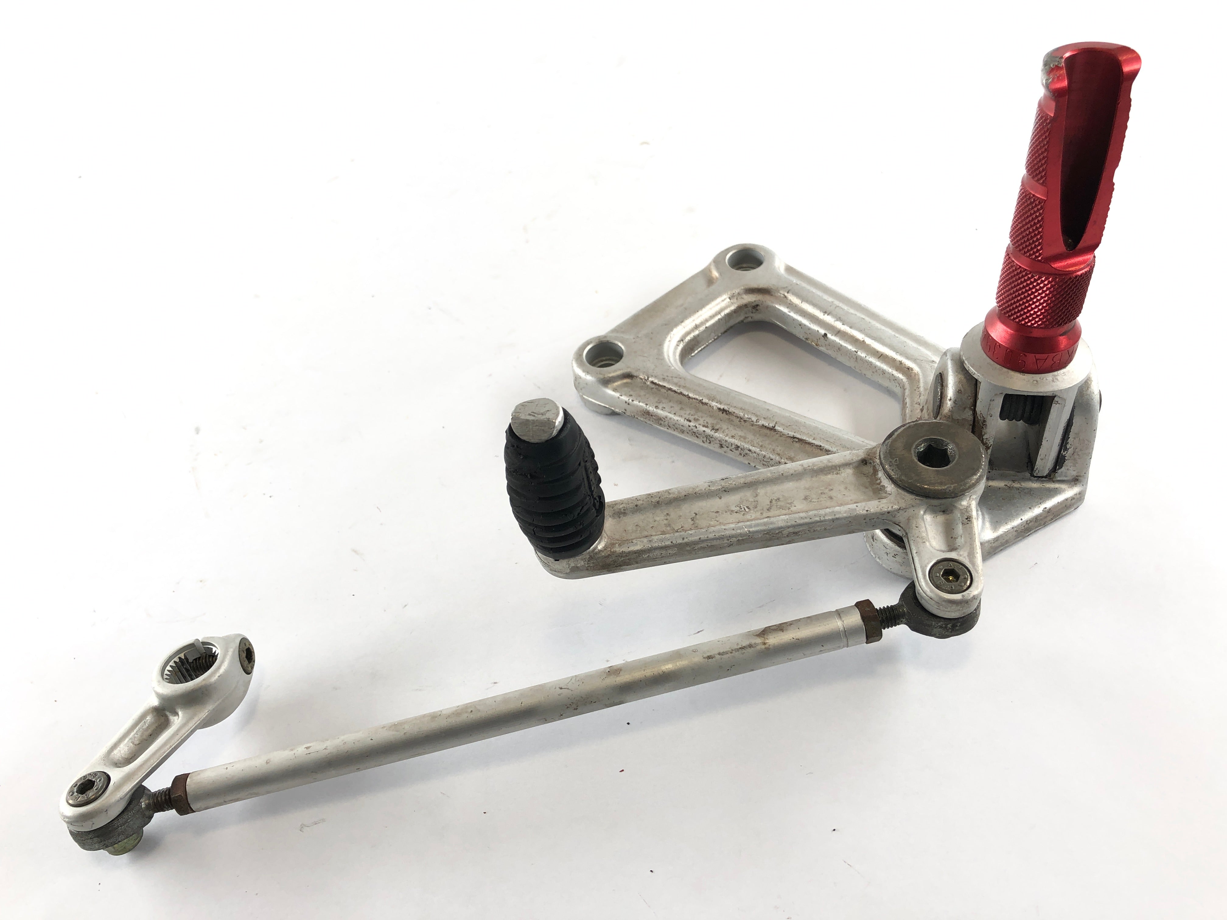 Ducati 900 SS [1993] - Driver footrest left with holder and gear lever